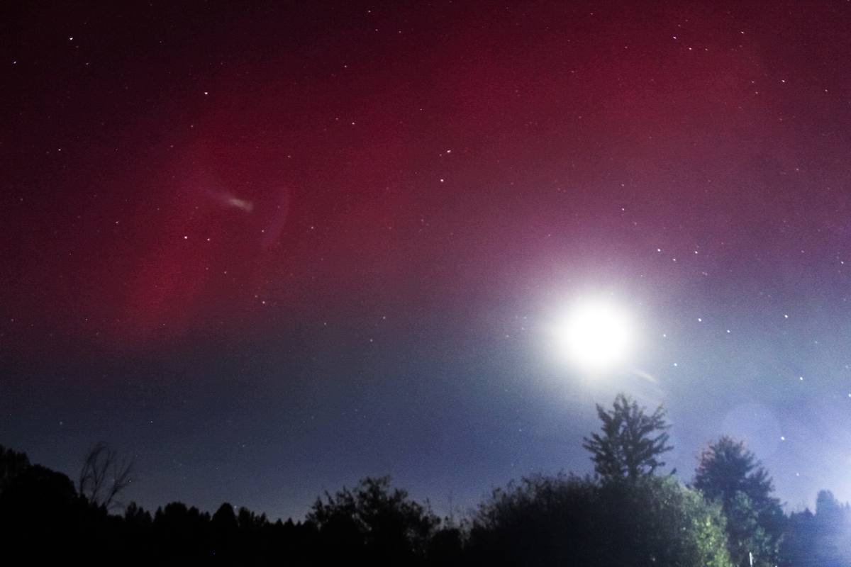 Red aurora with full moon · MadSara Images